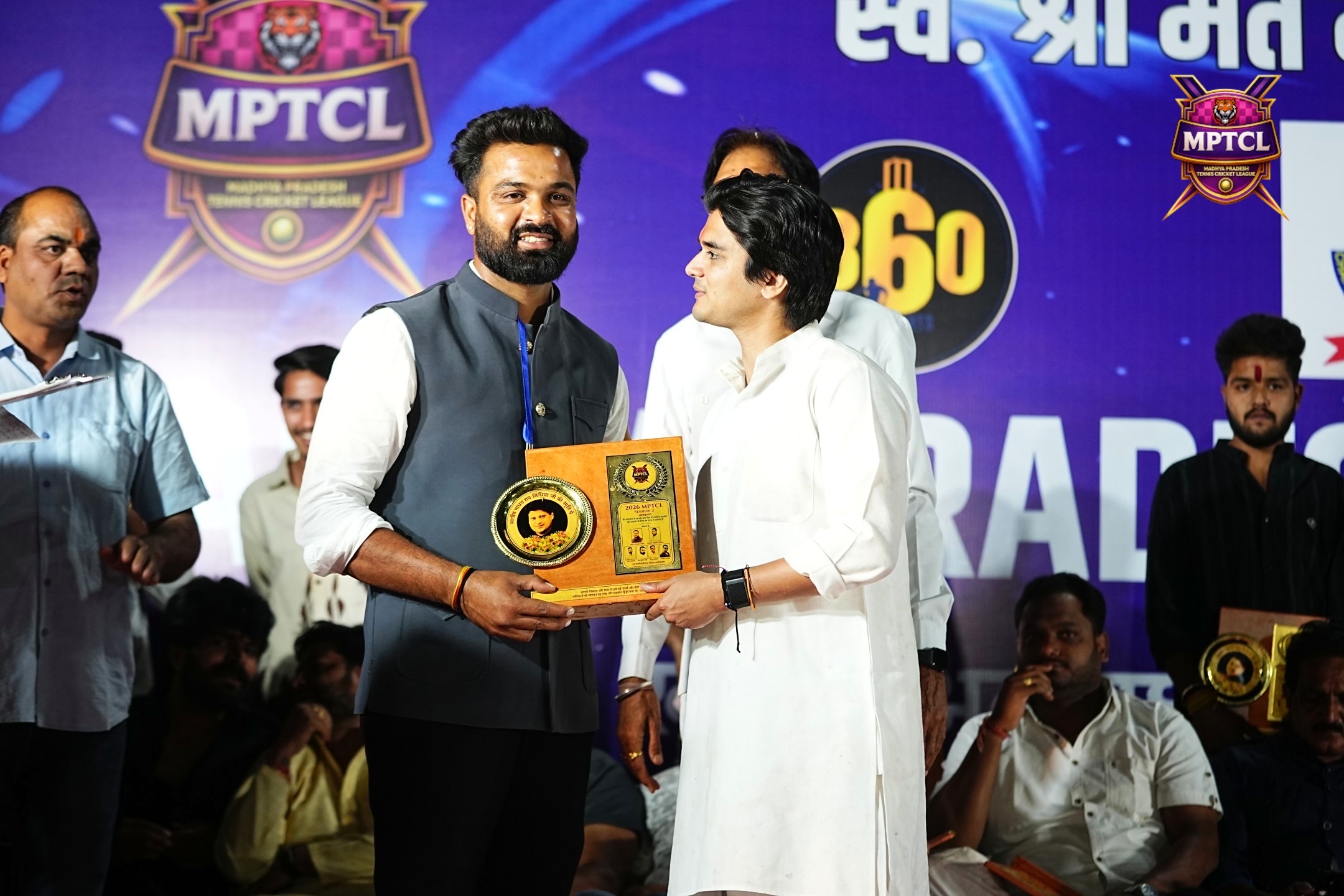 Award presentation on stage at MPTCL 2026