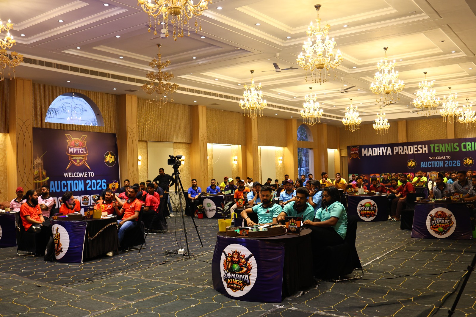 Auction paddles raised during MPTCL 2025